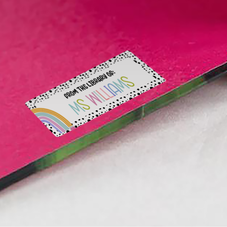 Rainbow Spotted Border Name Stickers on red inside cover of book