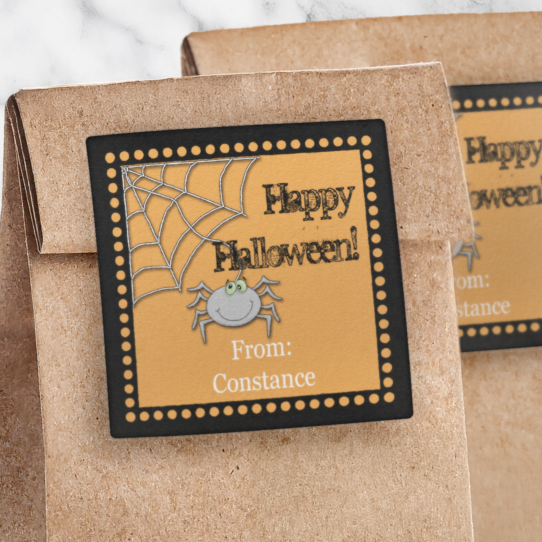 Spider Web Halloween Square Sticker on a brown paper bag
