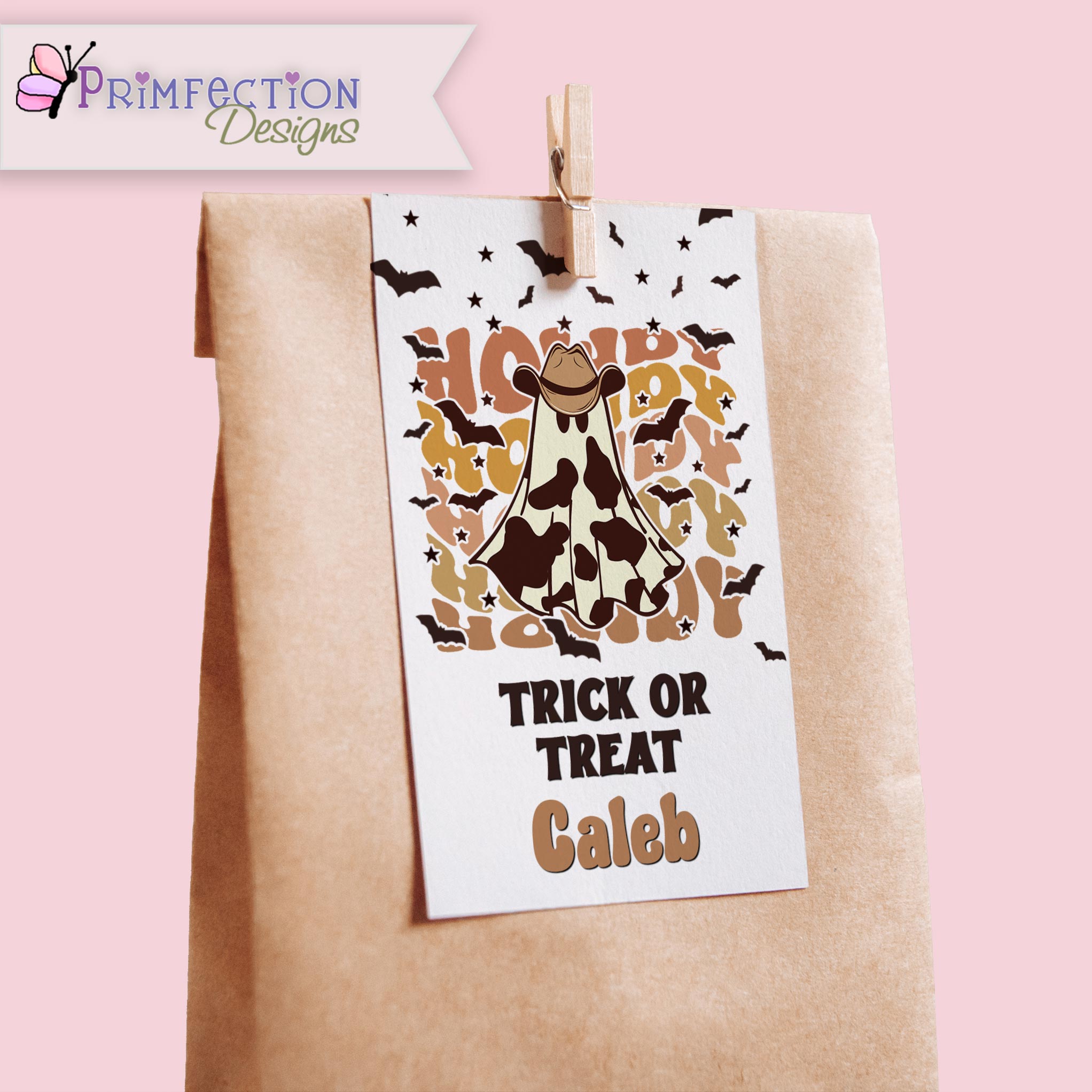 Halloween-themed treat bag with a cow costume design and 'Trick or Treat Caleb' text, attached to a pink background.