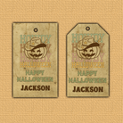 Two Halloween-themed tags with a pumpkin design and text on a textured beige background.