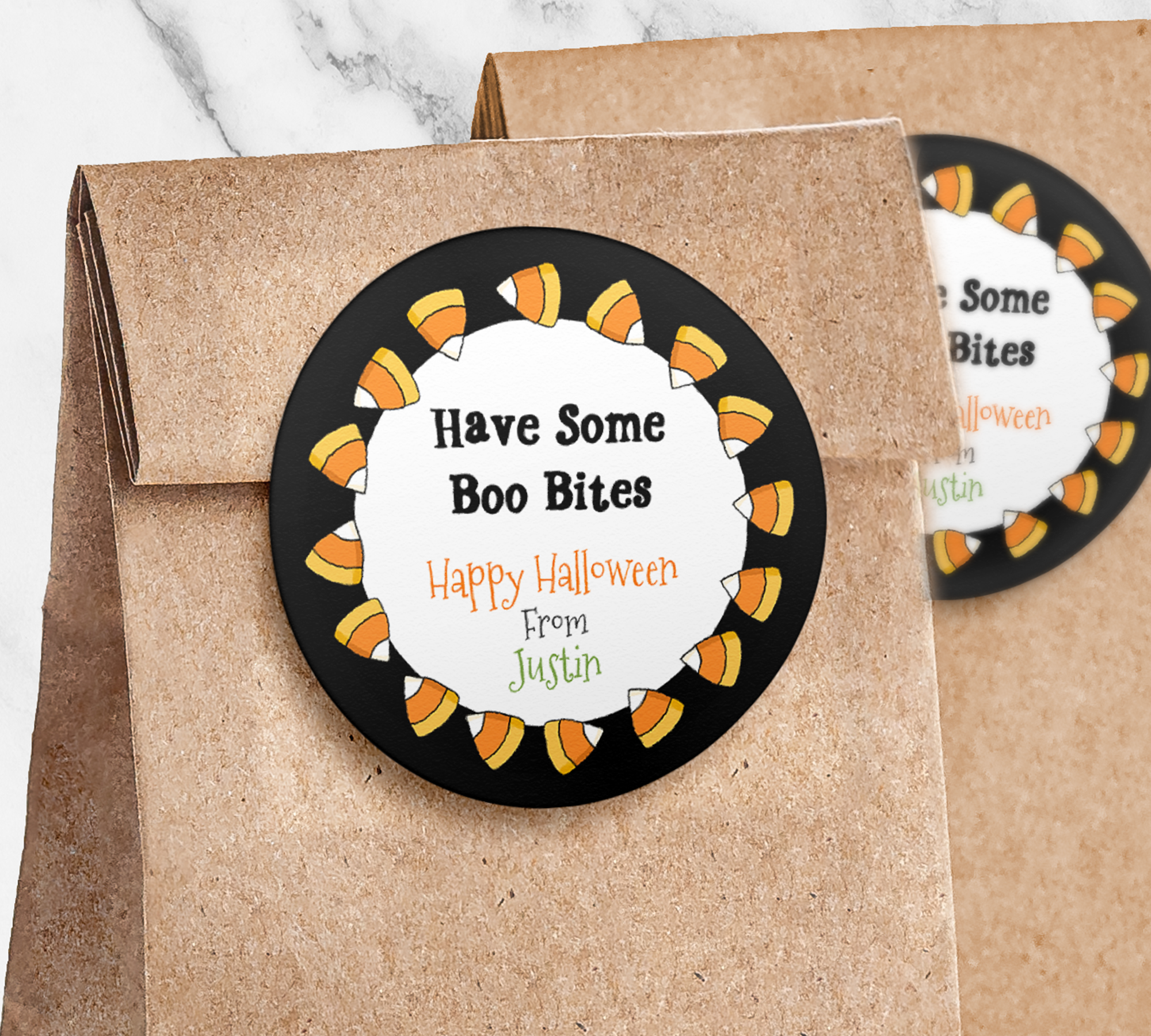 Round sticker with black colorul candy corn border on paper trick or treat bag